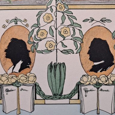 Détails d'une frise montrant les têtes de deux écrivains dans un médaillons derrière un livre 